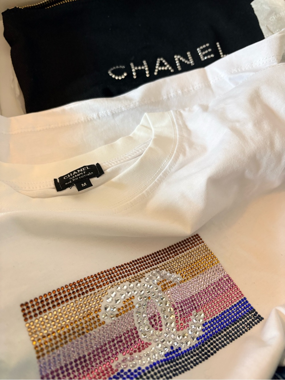 NEW IN BOX VIP ITEM
CHANEL White Tee with Black Pouch